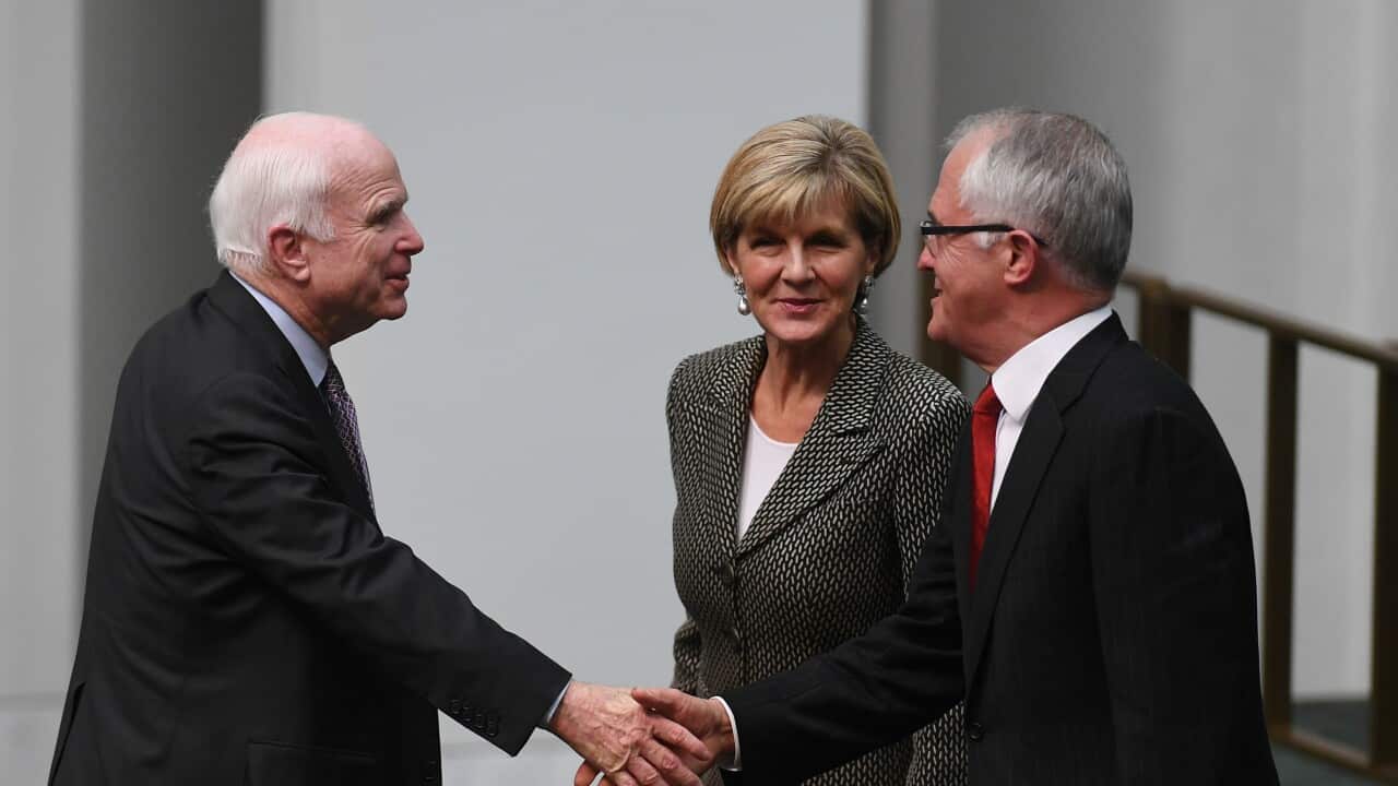 Australian Prime Minister Malcolm Turnbull (right) shakes hands with US Senator John McCain during House of Representatives Question Time at Parliament House in Canberra, Monday, May 29, 2017. (AAP Image/Lukas Coch) NO ARCHIVING