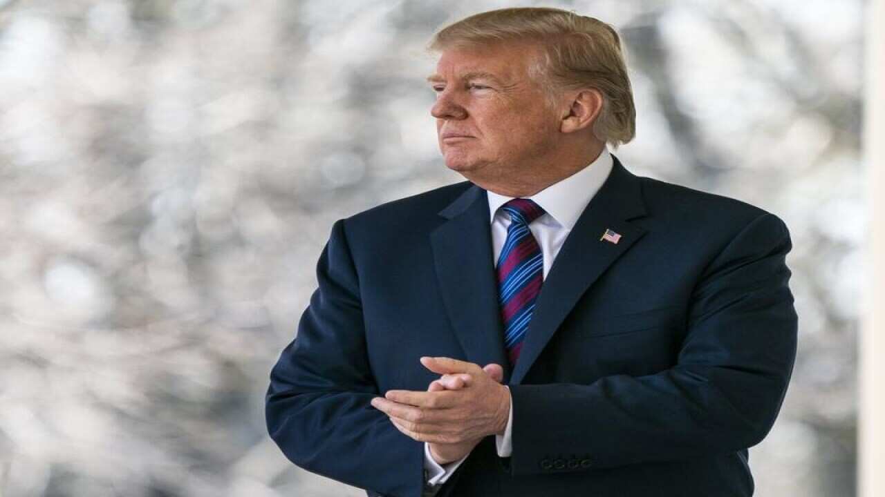US President Donald J. Trump prepares to speak at the White House.