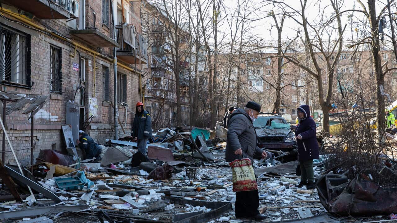 Civilians are seen in the streets amid the intensified Russian offensive encircling Kyiv.
