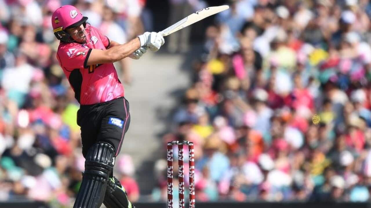 Moises Henriques of the Sixers swings at the ball