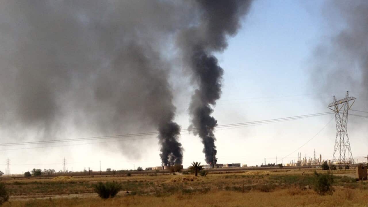 Smoke rising from the Baiji oil refinery