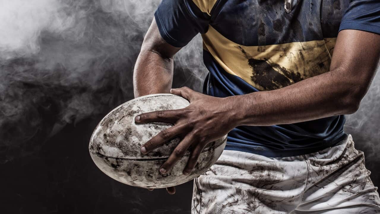 A bloody muddy Rugby Player