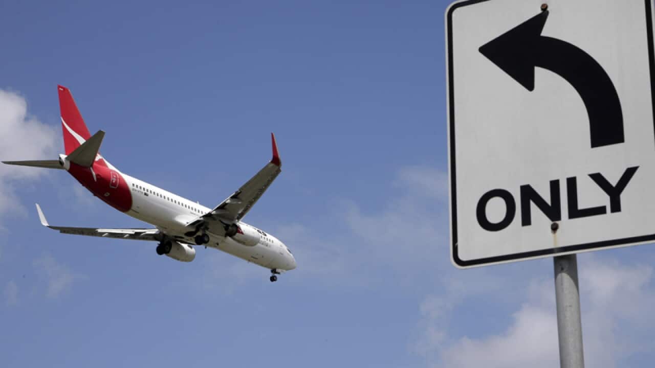 A Qantas plane prepares to land