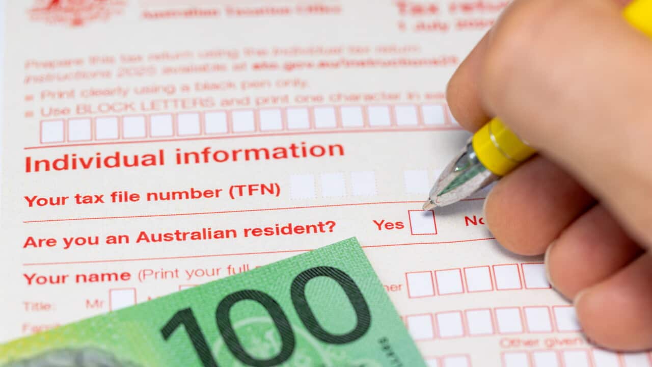 Tax return for individual. Australia tax settlement. Financial business concept. $100 Australian dollars. Filling out the declaration.