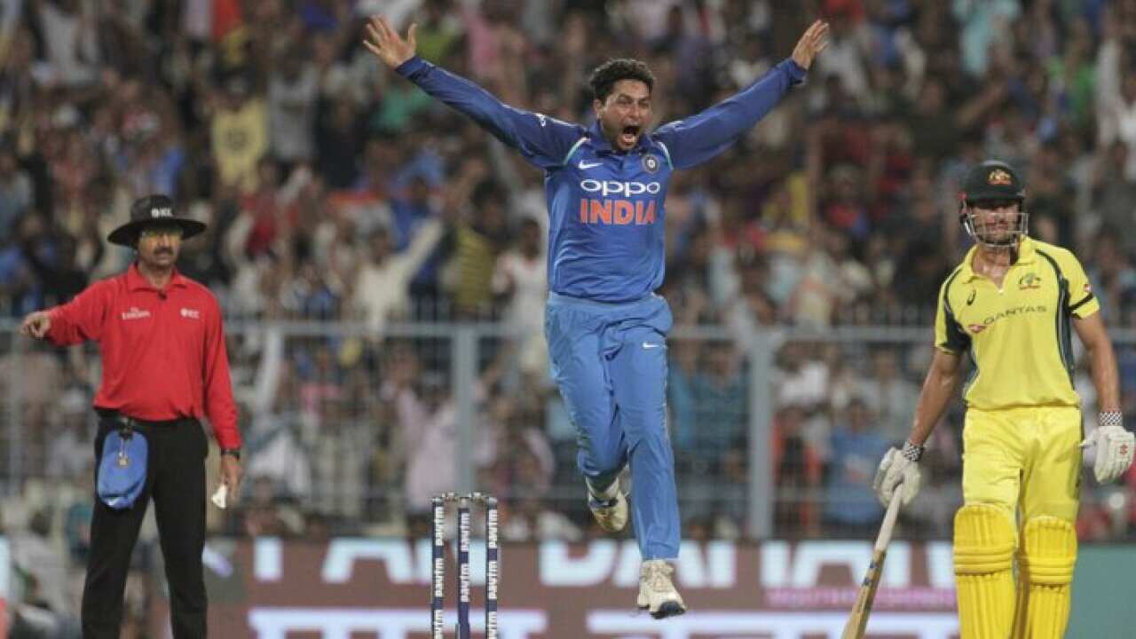 India's Kuldeep Yadav celebrates after taking his third wicket in an over during the second one-day international cricket match against Australia at Eden Gardens in Kolkata, India, Thursday, Sept. 21, 2017. (AP Photo/Bikas Das)