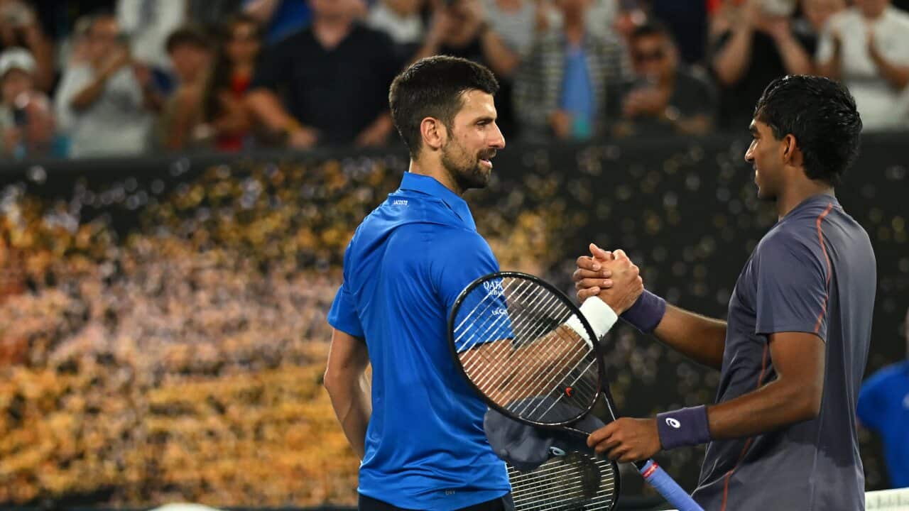 Novak Djokovic of Serbia greets US' Nishesh Basavareddy after their first round match at the 2025 Australian Open at Melbourne Park
