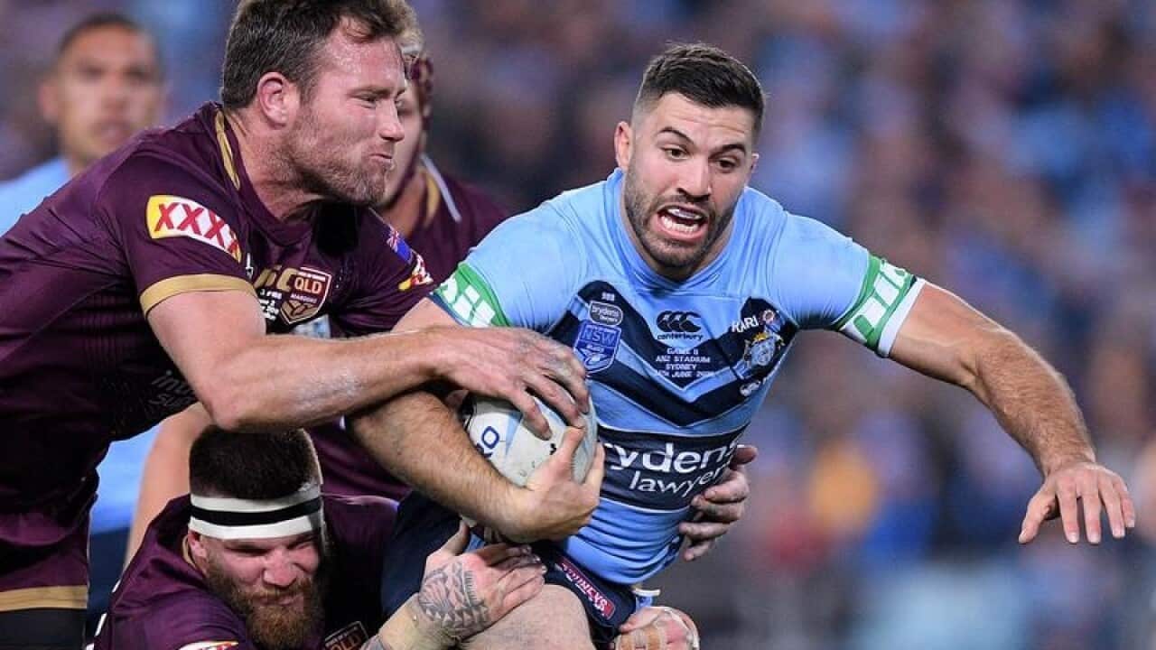 James Tedesco of the Blues is tackled.