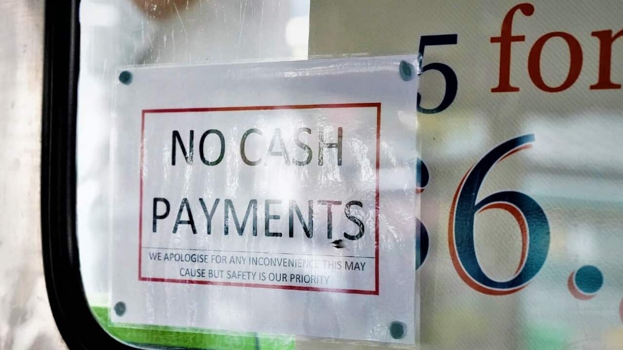 A 'No cash payment' sign on the doughnut van at the Queen Victoria Markets, in Melbourne.