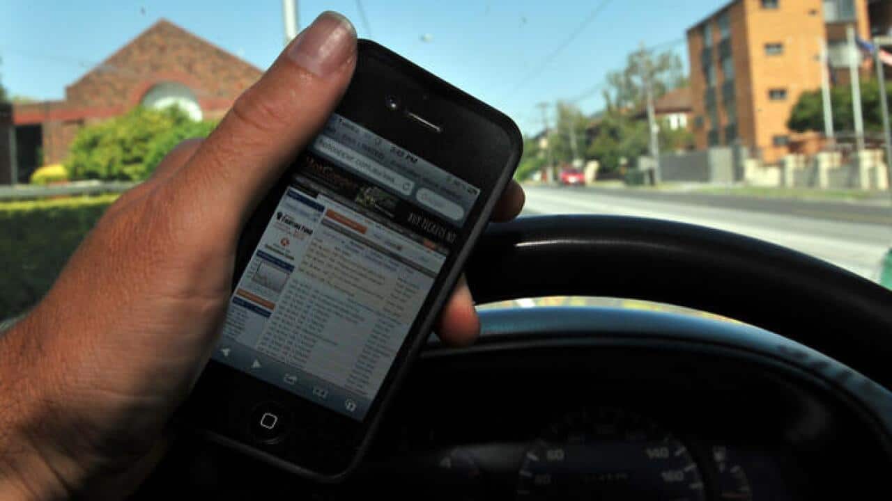 Queensland drivers face $1000 fine if caught using phone
