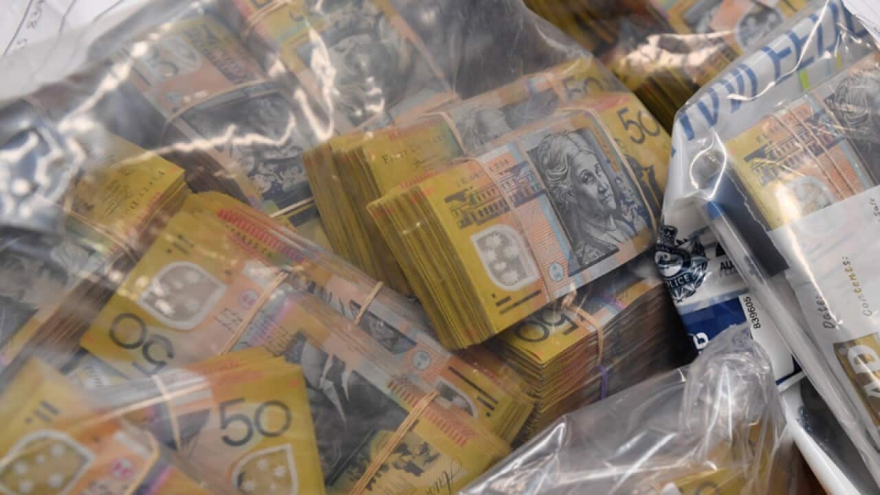 Seized items are displayed at a press conference