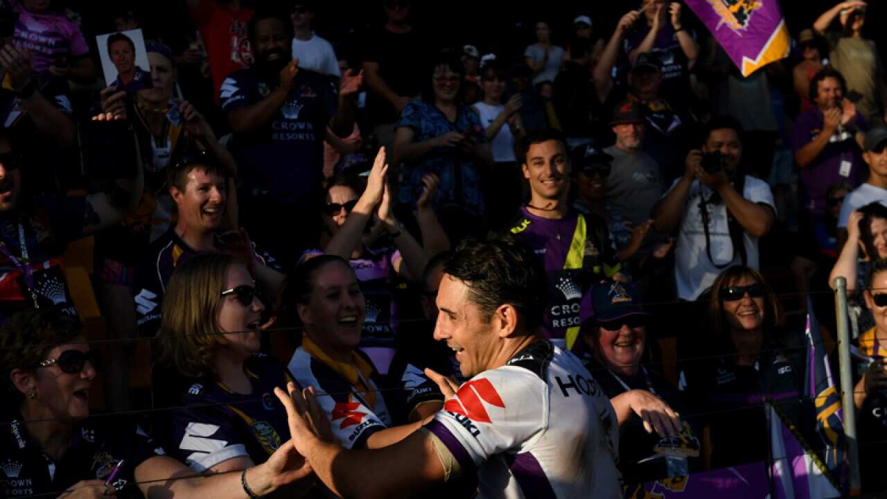 Billy Slater of the Storm celebrates their win with fans