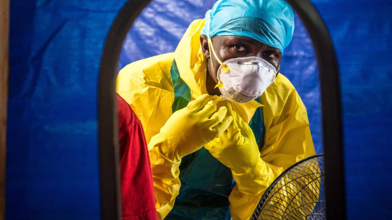 A healthcare worker wears protective gear in Sierra Leone