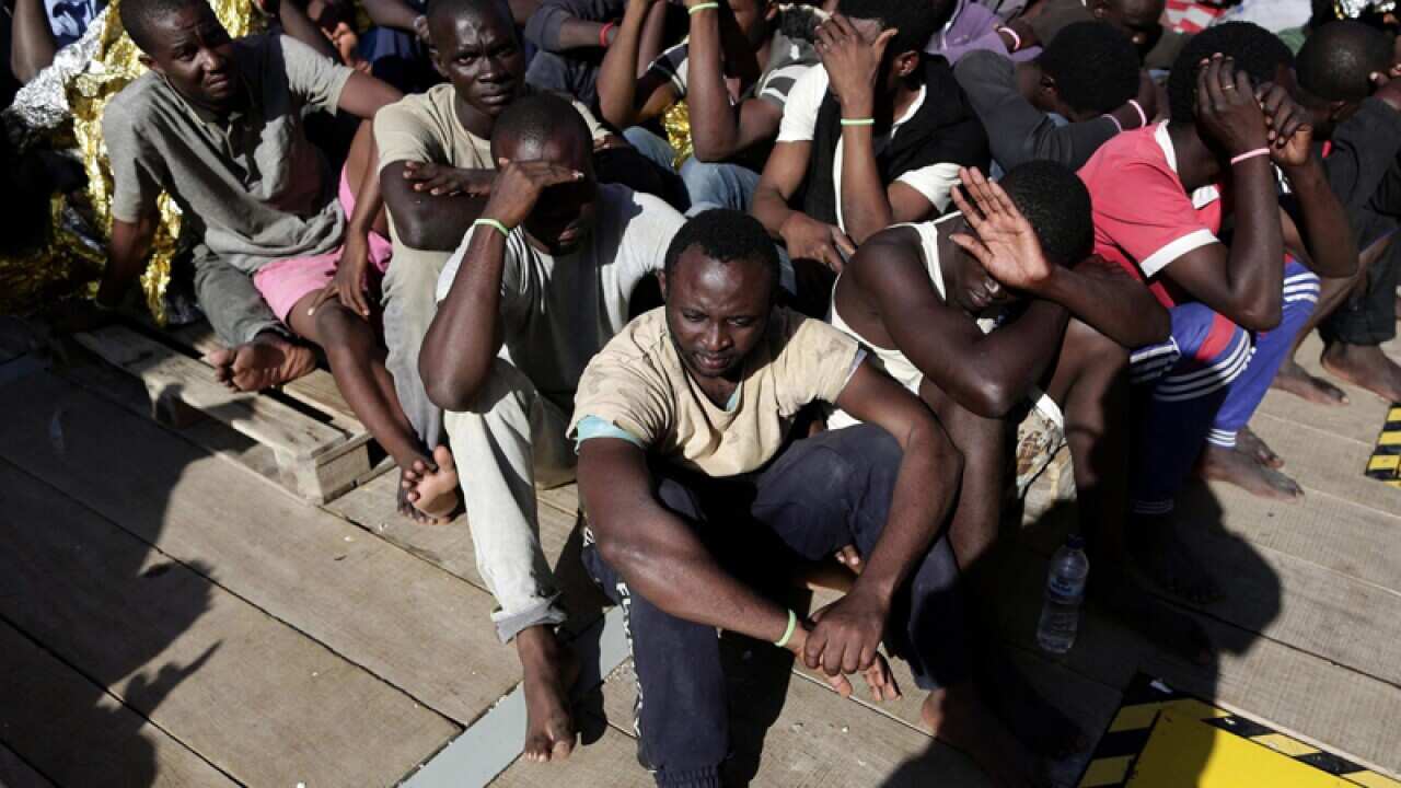 Migrants onboard the flagship rescue vessel in Vibo Marina, Italy