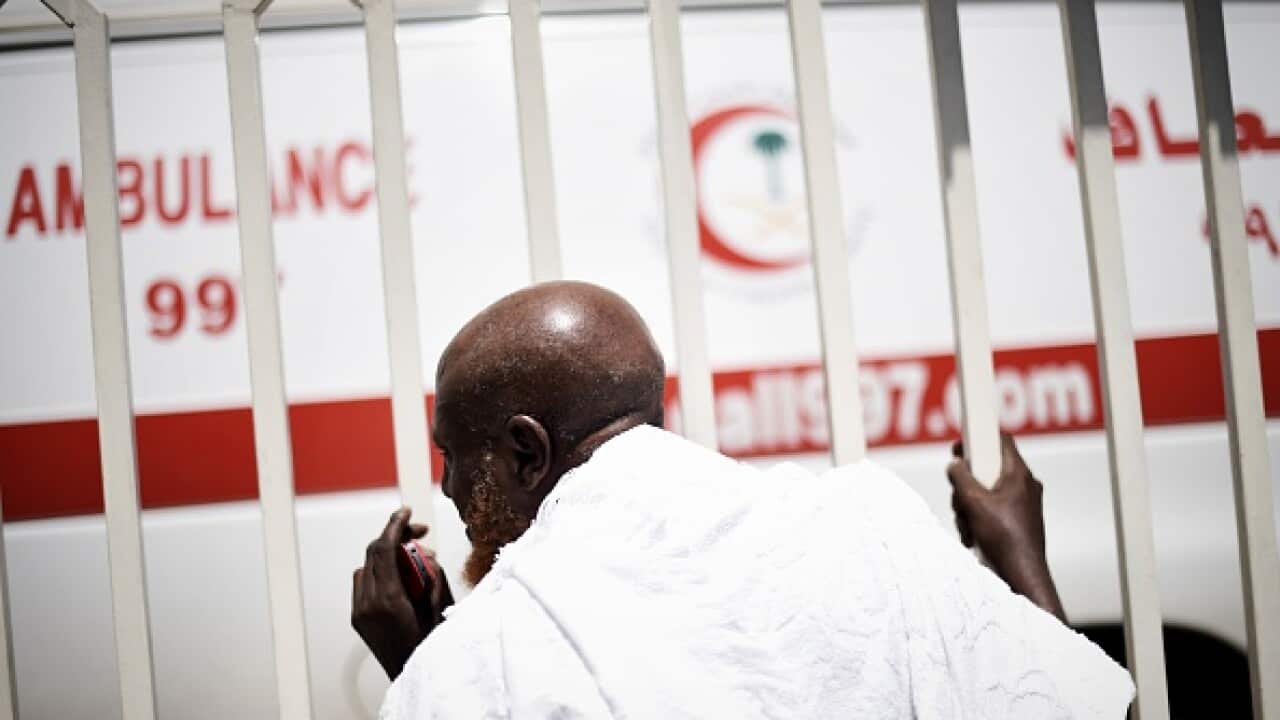 A Muslim pilgrim searches for a relative who was injured in a stampede in Mina, near the holy city of Mecca (MOHAMMED AL-SHAIKH/AFP/Getty Images)