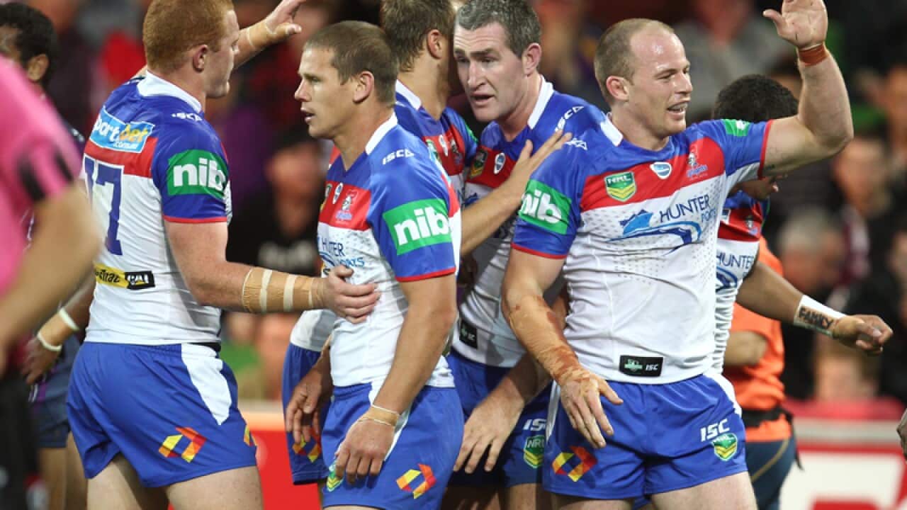 Knights celebrate after beating Melbourne in the NRL semi-final