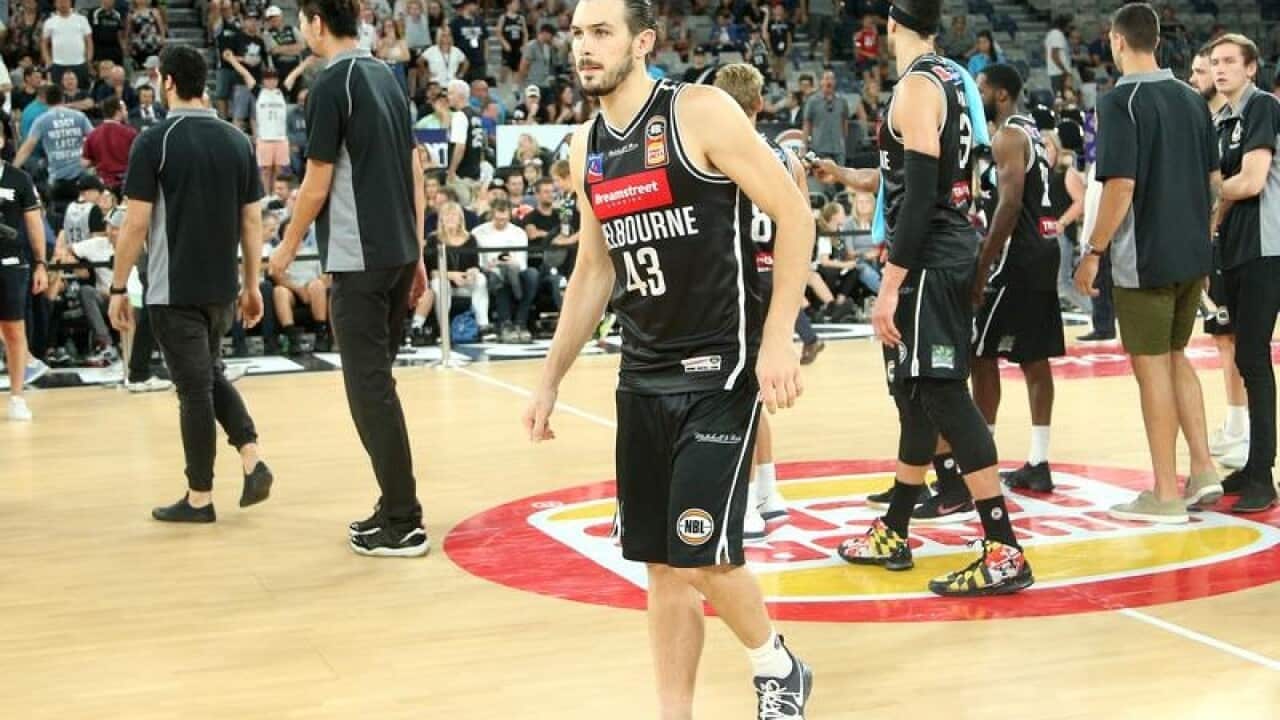 Chris Goulding of Melbourne with an injured ankle