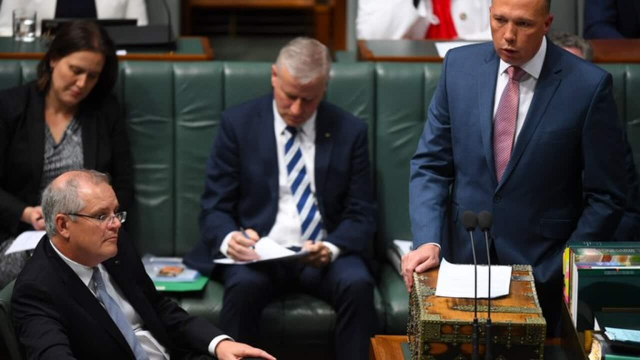 Australian Home Affairs Minister Peter Dutton speaks during House of Representatives Question Time at Parliament House in Canberra.