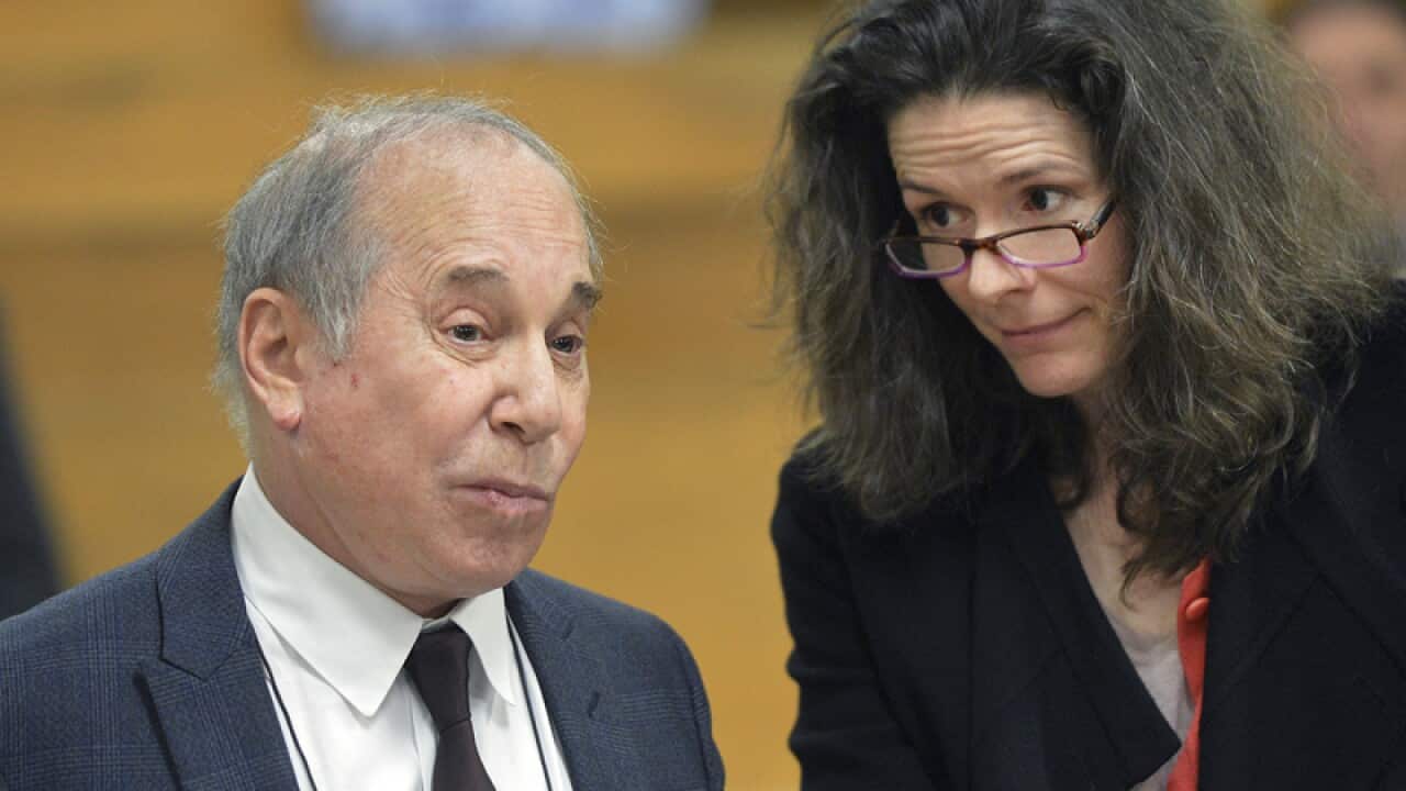 Singer Paul Simon, left, and his wife Edie Brickell