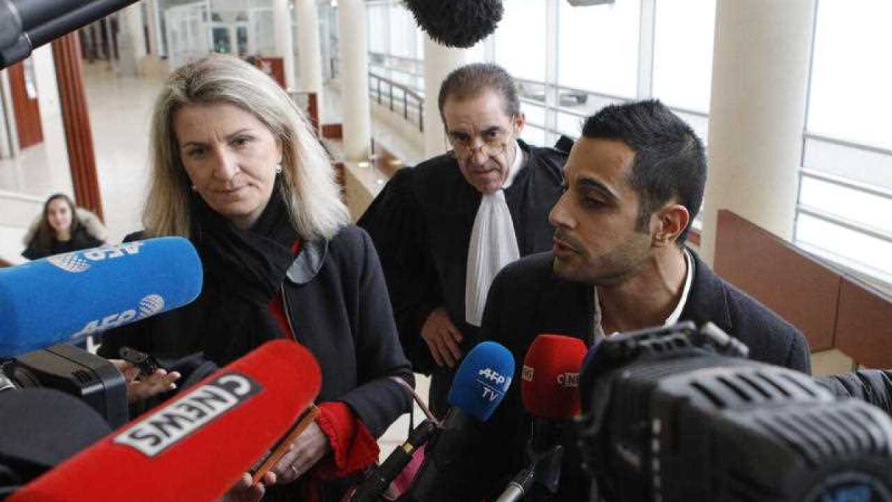Lawyers for the suspect Marc Goudarzian and Sandrine Parise-Heideiger, left, answer reporters at the hall of justice Tuesday, February 13, 2018 in Pontoise, outside Paris.