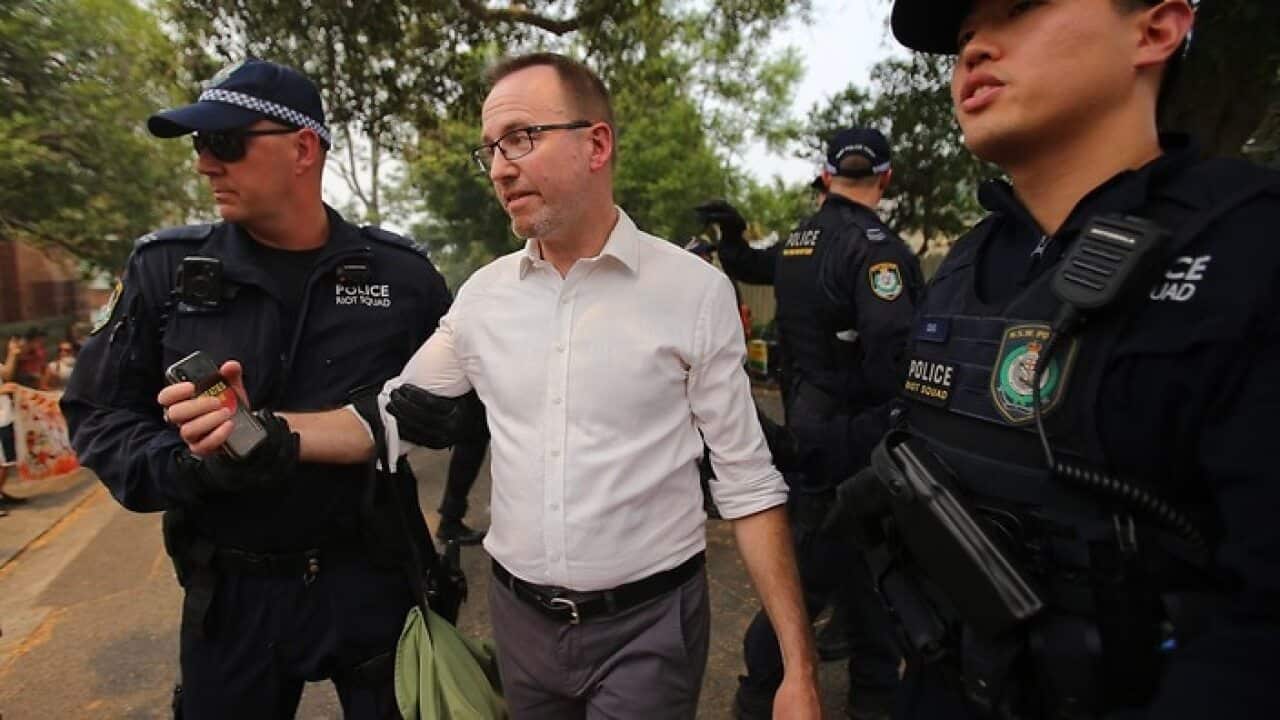 Greens MP David Shoebridge is arrested by police during the protest outside Prime Minister Scott Morrison's Sydney residence.