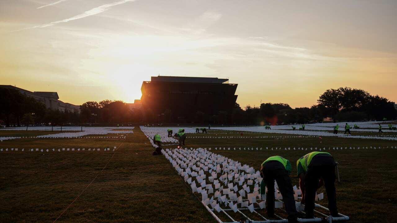 Over 650,000 white flags are being planted on National Mall to honour US Covid deaths.