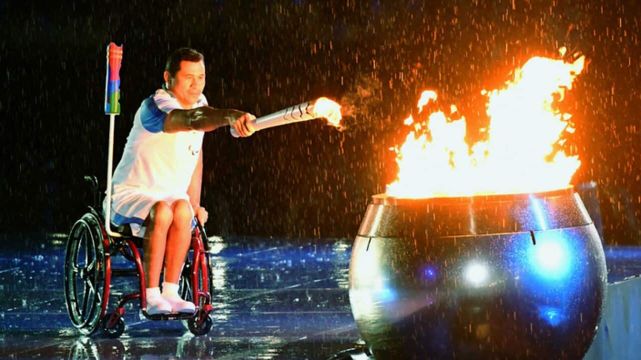 Brazilian swimmer Clodoaldo Silva, as the last runner of the Rio de Janeiro Paralympic torch relay, lights the cauldron during the opening ceremony at Maracana Stadium on Sept. 7, 2016. The Games run through Sept. 18. (Kyodo)==Kyodo