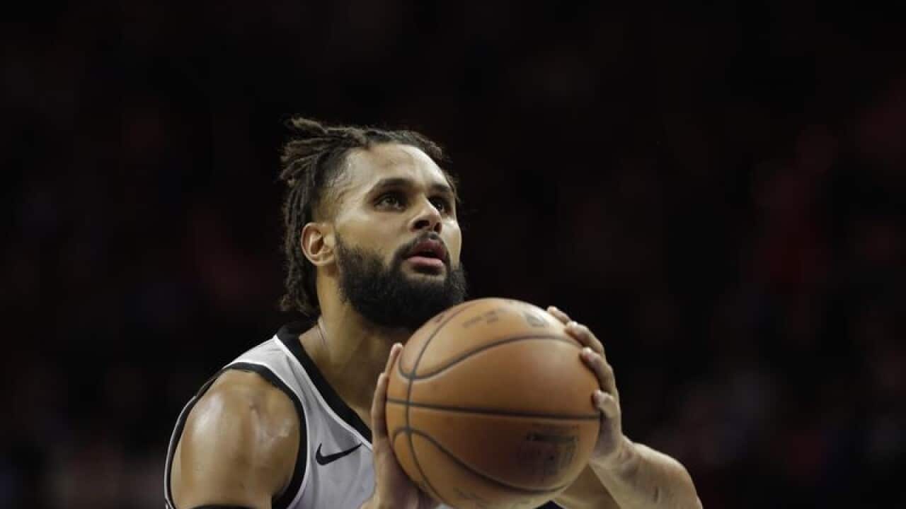 San Antonio Spurs' Patty Mills in a action.