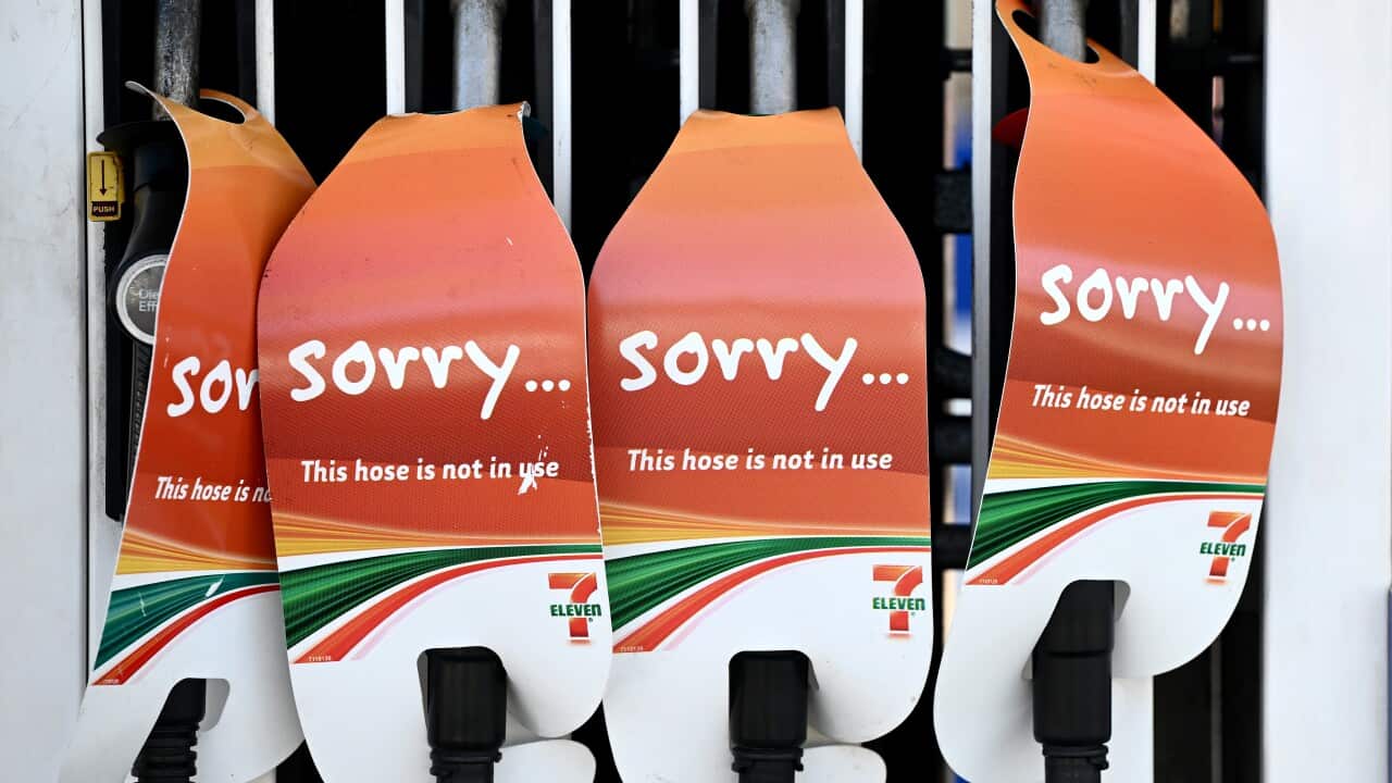 Petrol pumps with signs saying 'sorry this hose is not in use'