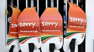 Petrol pumps with signs saying 'sorry this hose is not in use'