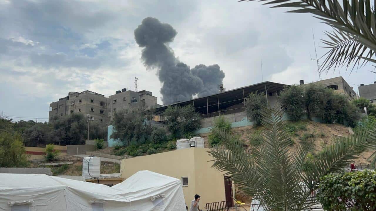 Smoke rising after an airstrike against a building.