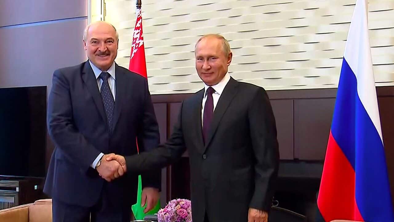 Belarusian President Alexander Lukashenko, left, and Russian President Vladimir Putin shake hands during their meeting in Sochi, Russia.