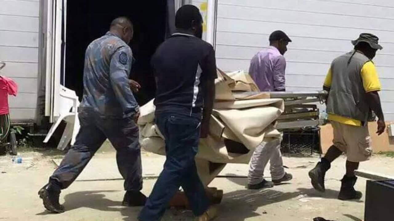 Marquee being dismantled inside the Manus Island detention centre