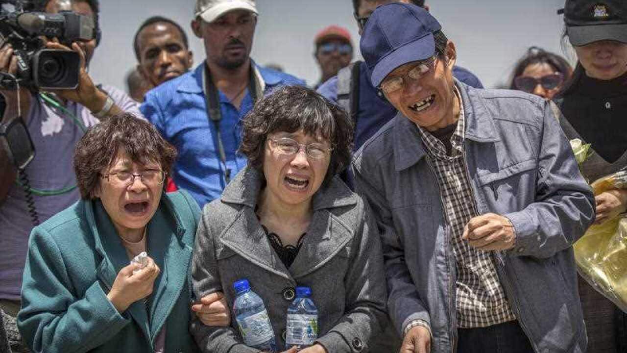 Relatives react at the scene