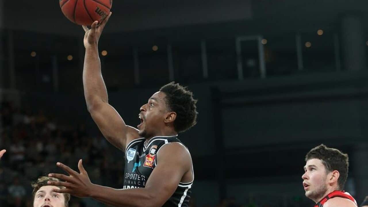 Casper Ware leaps and shoots during a NBL game against Perth Wildcats.