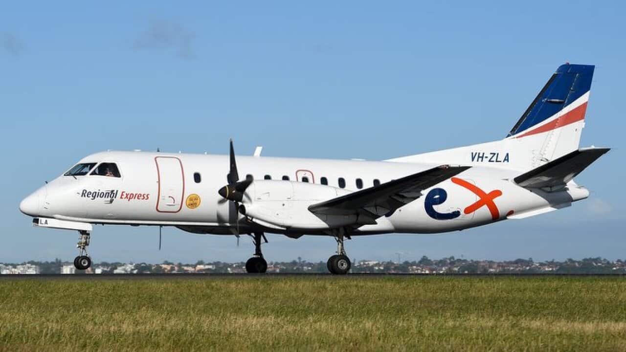 A Regional Express (REX) Saab 340B aircraft is seen landing at Sydney Domestic Airport, Monday, Nov. 16, 2015