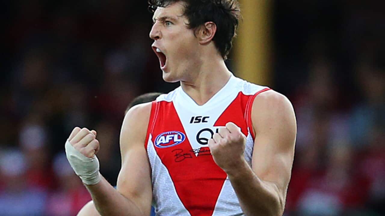 Sydney Swans forward Kurt Tippett celebrates after kicking a goal