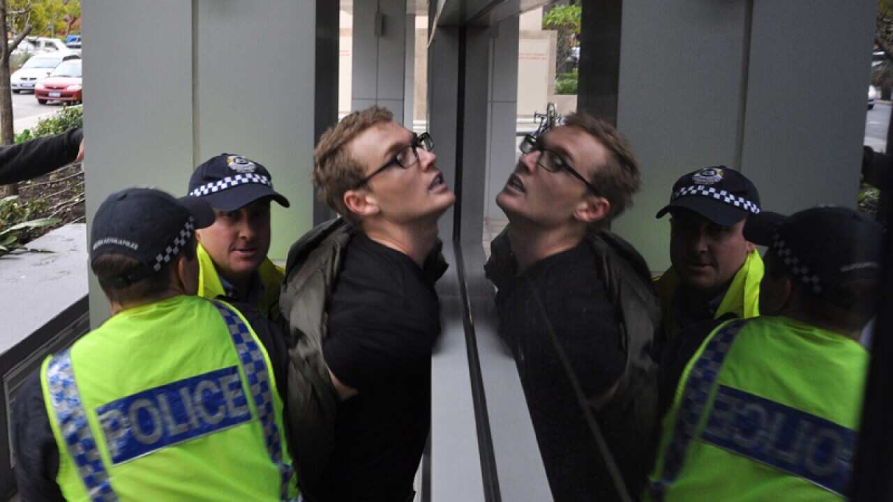 A Rally Against Racism protester is arrested