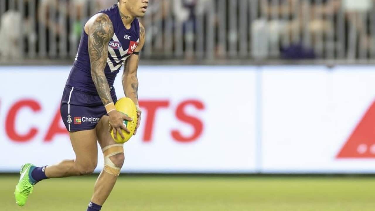 Michael Walters of the Dockers kicks on goal
