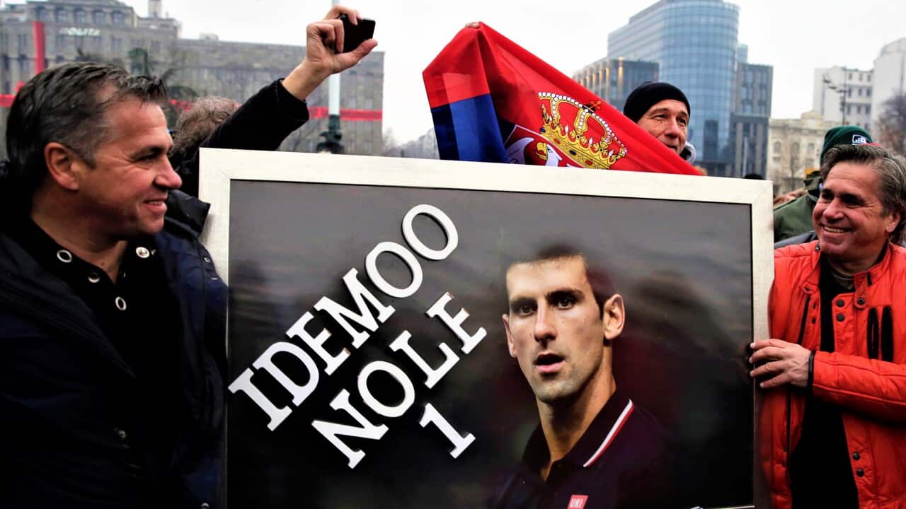 Supporter of Serbian tennis player Novak Djokovic hold a banner during a protest of support in Belgrade, Serbia, 08 January 2022.