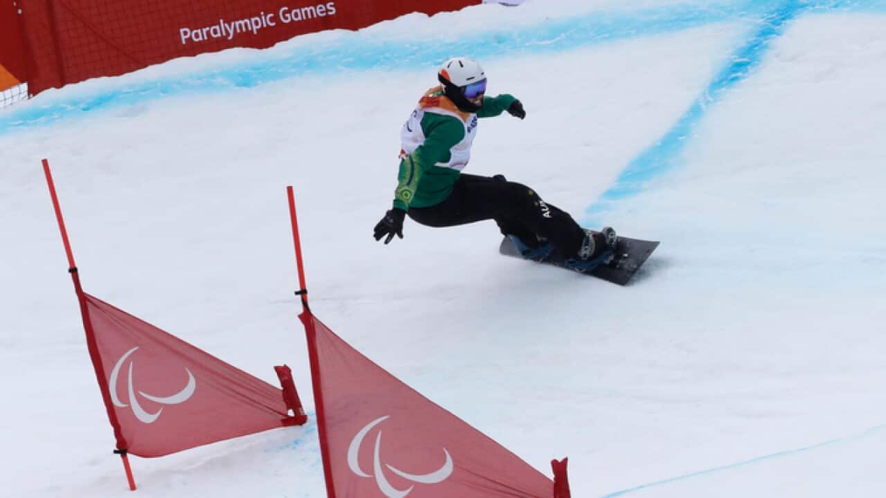 Bronze medal winner Simon Patmore of Australia competes in the men's snowboard banked slalom sb-ul at the 2018 Winter Paralympics in Jeongseon, South Korea, Friday, March 16, 2018. (AP Photo/Lee Jin-man)