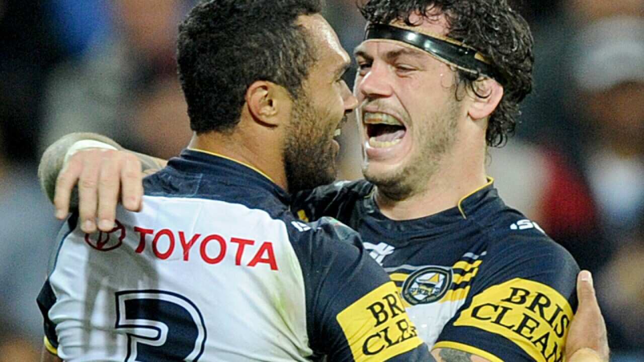 Justin O'Neill of the Cowboys (left) is congratulated.