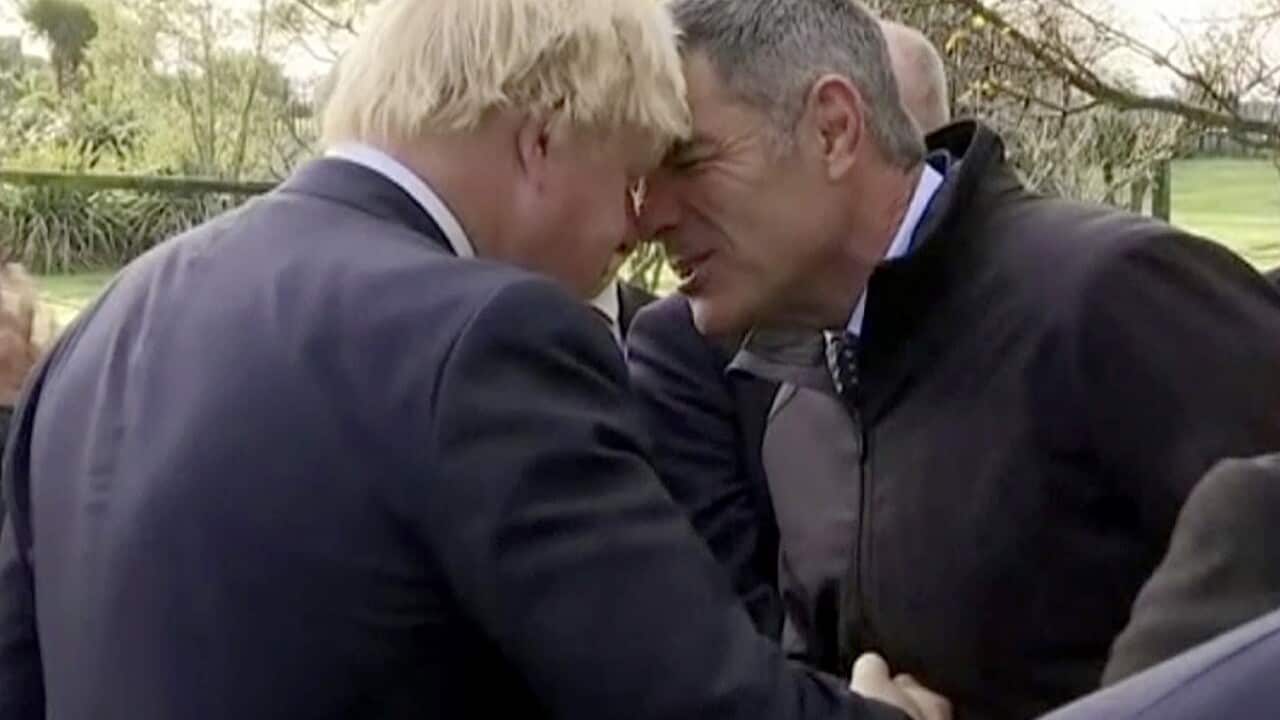 British Foreign Secretary Boris Johnson performs a hongi, a traditional Maori greeting with New Zealand Minister for Primary Industries Nathan Guy