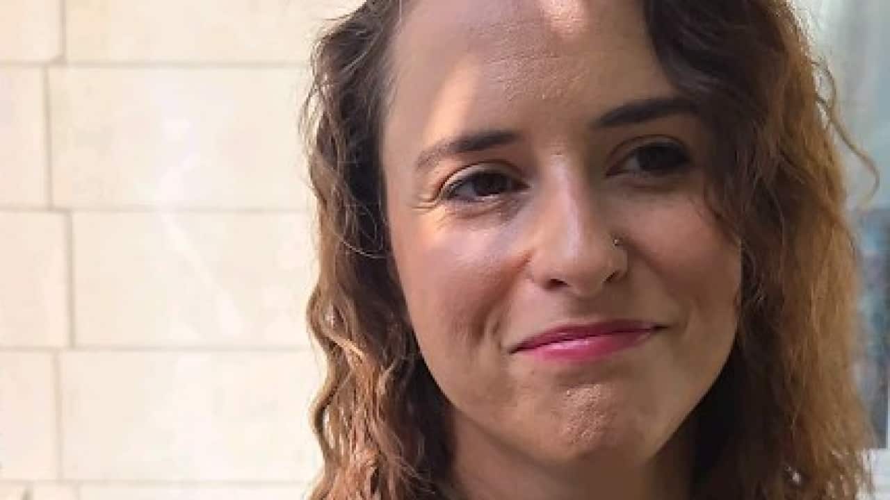 A woman filimg a video of herself speaking