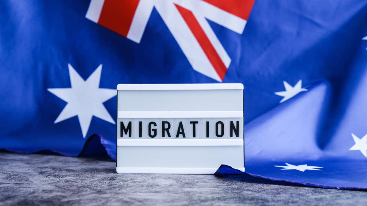 Message MIGRATION on background of Australian flag made from silk. Australia national flag with concept of tourism and traveling. welcoming