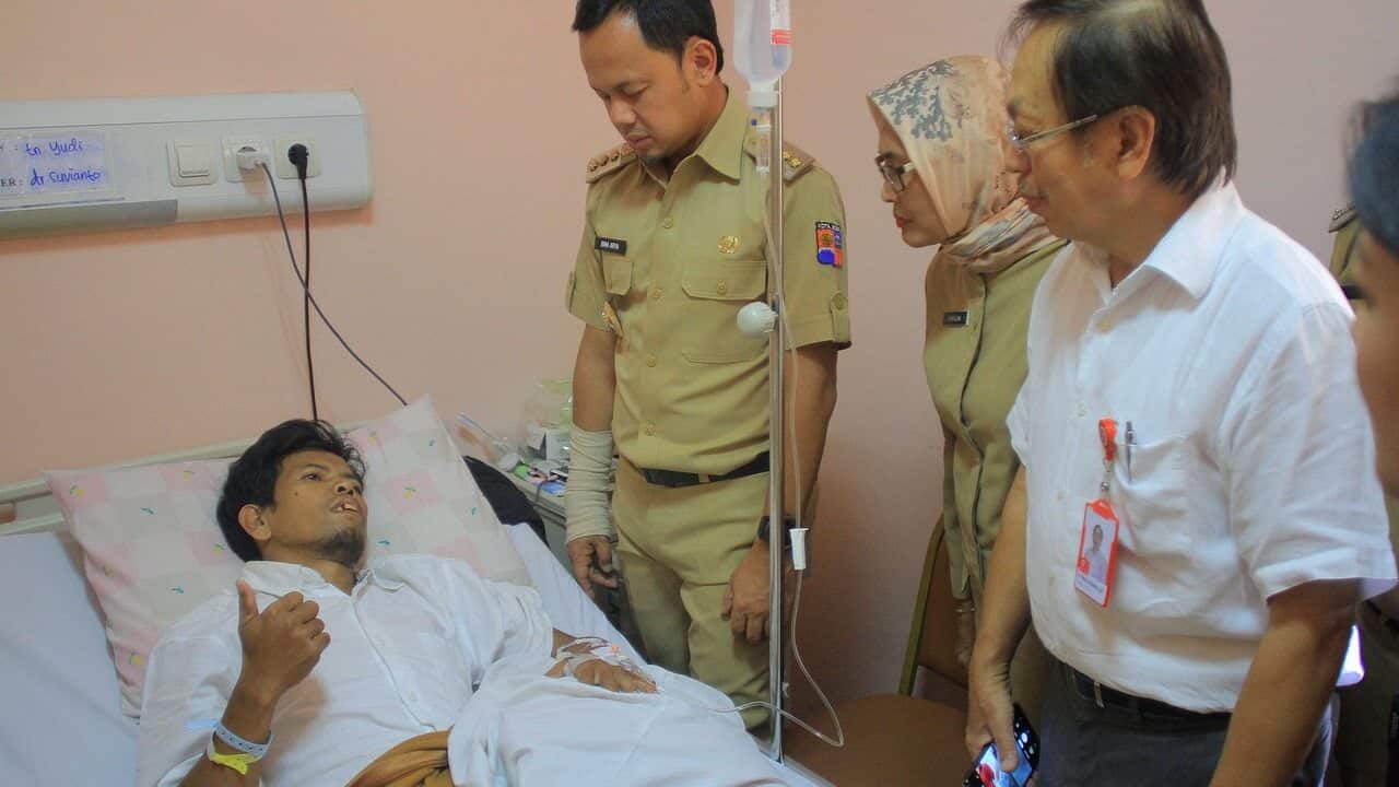 The Mayor of Bogor, Bima Arya (third right) visits officers of the Voting Organizing Group in the Hospital, Bogor, West Java, Indonesia.
