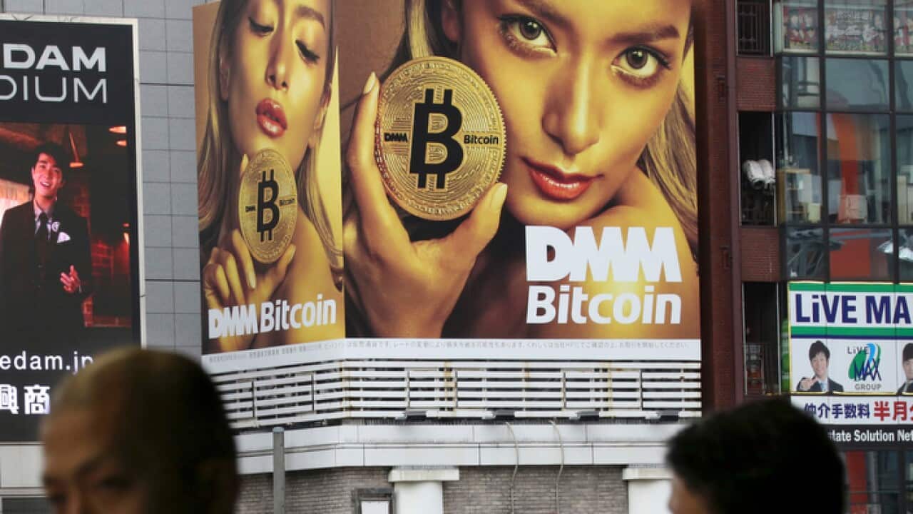 A huge bitcoin ad near a train station in Tokyo
