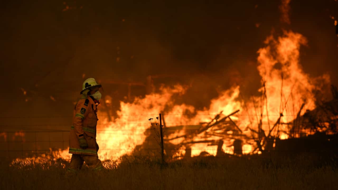 NSW Rural Fire Service crews fight the Gospers Mountain Fire as it impacts a property at Bilpin, Saturday, December 21, 2019.