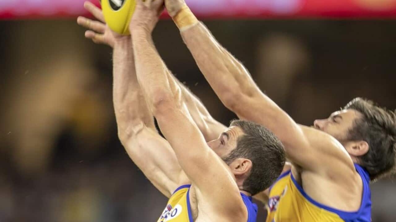 Jack Darling and Josh Kennedy of the Eagles contest for a mark.