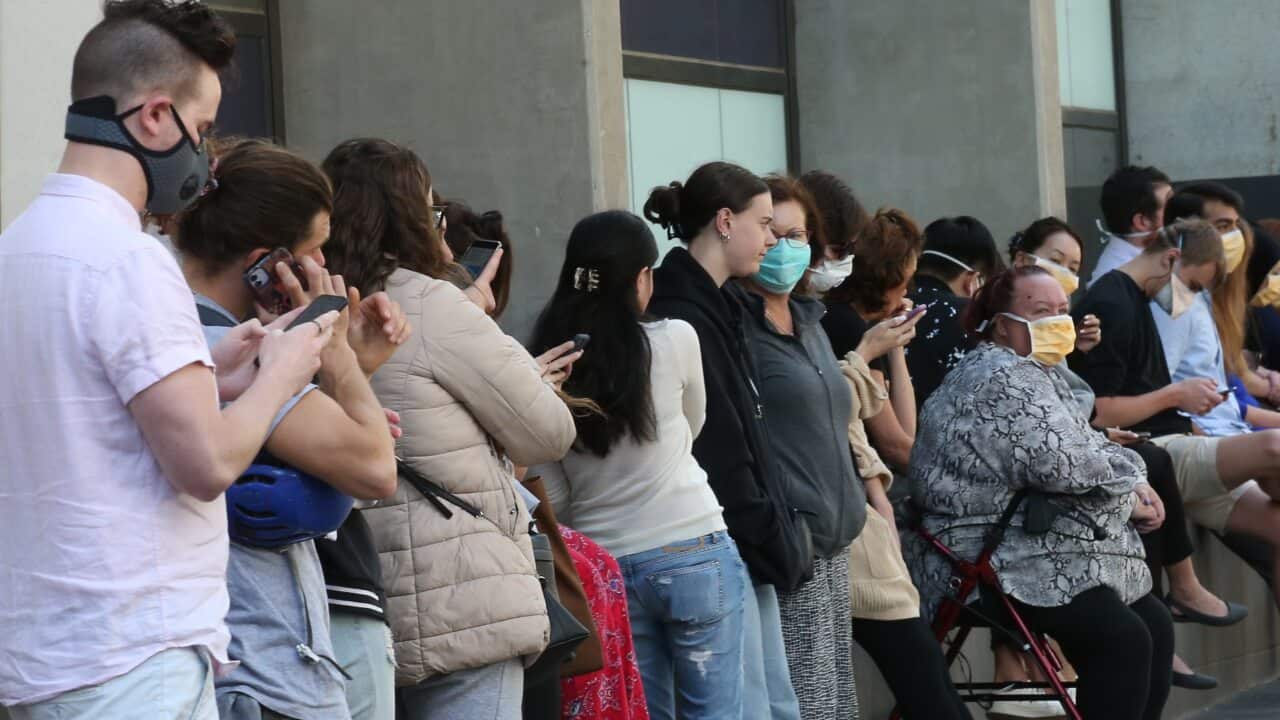 Patients line up at the Royal Melbourne Hospital for coronavirus testing.