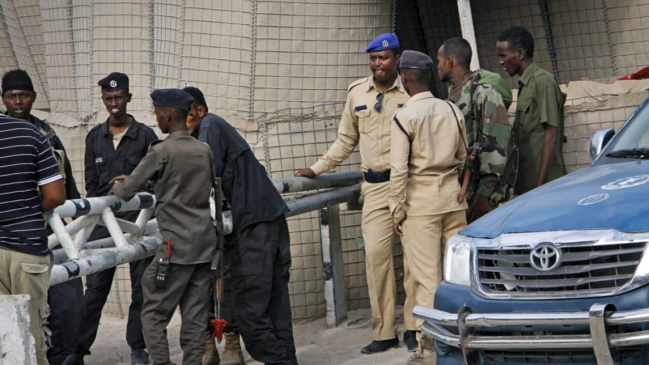 An Islamic extremist suicide bomber disguised as a police officer killed a number of them after infiltrating a police academy in Mogadishu, Somalia.